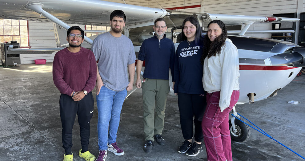 Fresno State Students Jose Lopez, Isaac Ramos, Grace Burton and Angel Vargas spent Saturday morning tutoring and mentoring middle- through high school students in mathematics at New Vision Aviation at the Fresno Chandler Executive Airport.