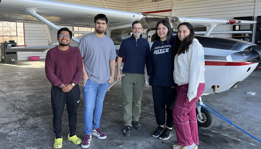 Fresno State Students Jose Lopez, Isaac Ramos, Grace Burton and Angel Vargas spent Saturday morning tutoring and mentoring middle- through high school students in mathematics at New Vision Aviation at the Fresno Chandler Executive Airport.
