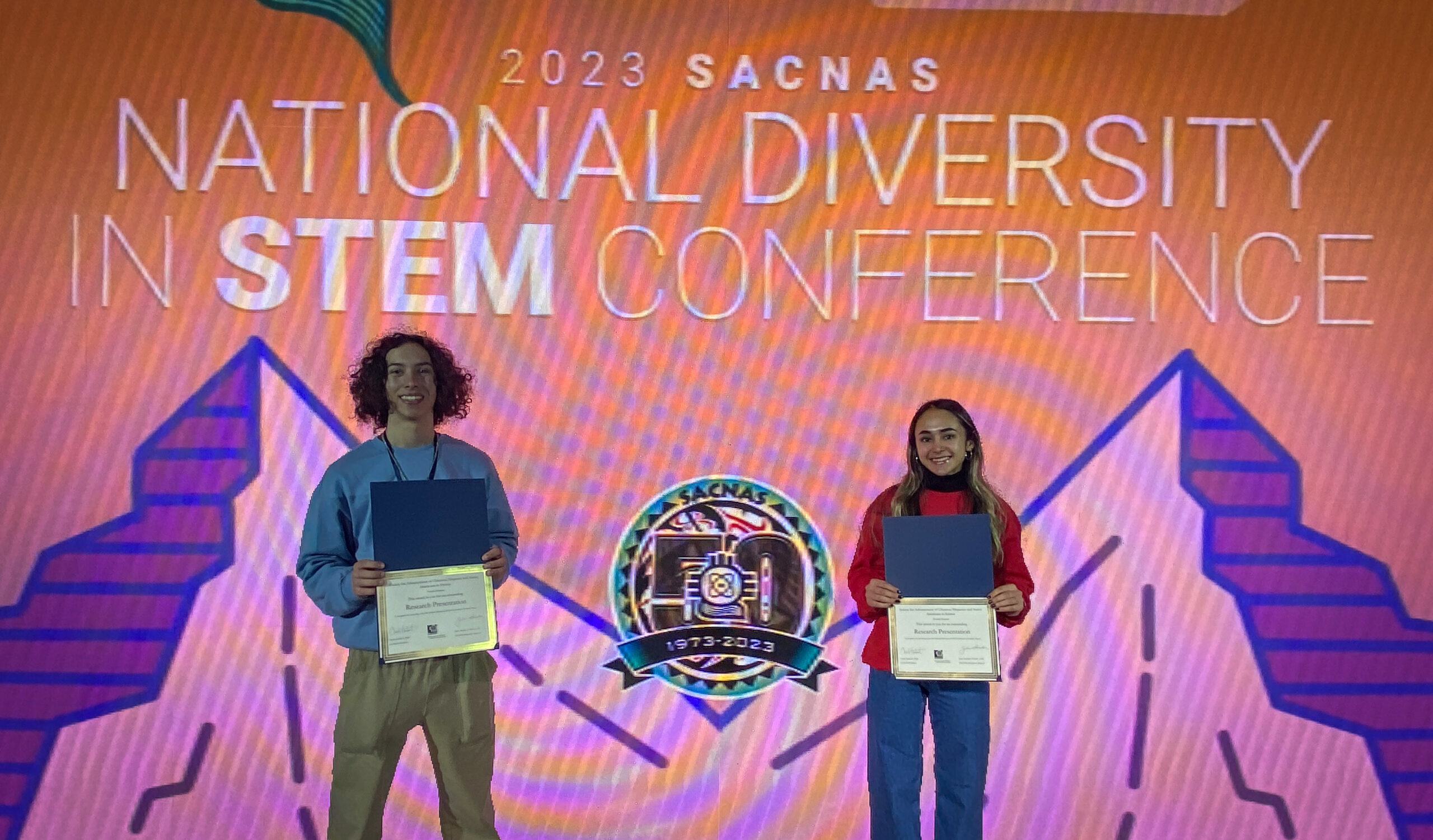 Benjamin Awad and Keyara Piri display their presentation award certificates won and the SACNAS Conference.