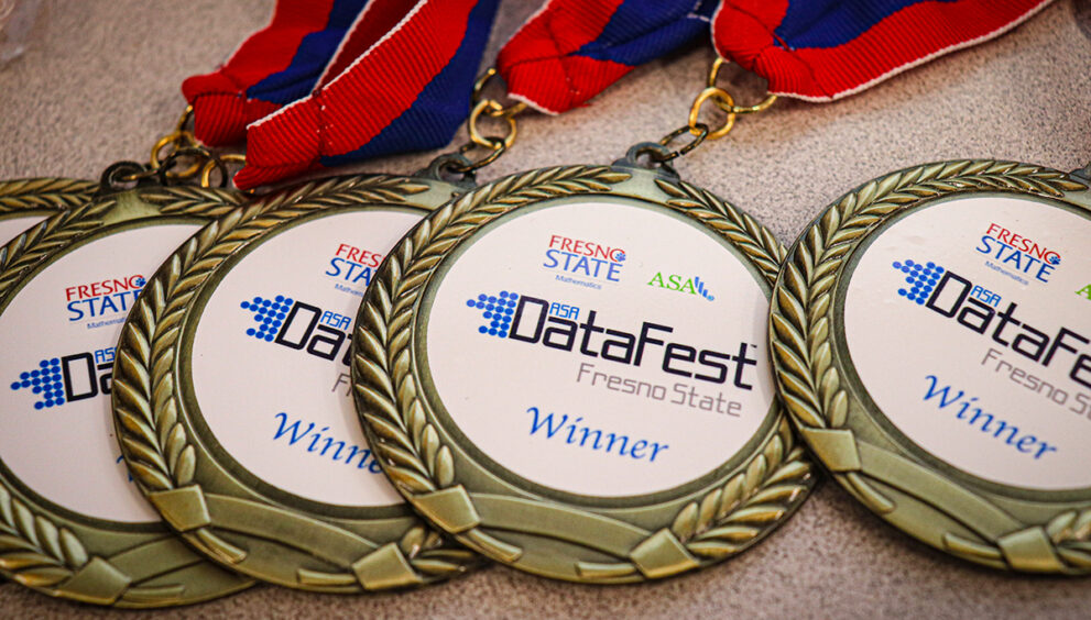 4 DataFest medals on an off-white background